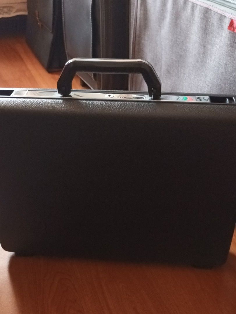 Authentic 1980's Samsonite Delegate Hard Shell Attache Case (Category: Briefcases) located in Quezon City. Submitted by happyvintage49 (Listing ID 1465974215, Image 1). Description: - Authentic vintage Samsonite Delegate attache case - Stylish black, hard-shell exterior finish with stainless detail - Clean dark fabric interior with built-in organizers - Mechanical push-lock latch system secured with a matching metal key - Perfect for work, meetin