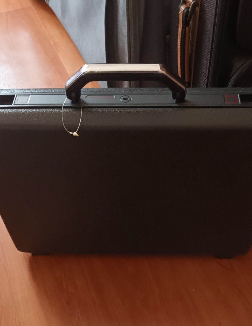 Authentic 1980's Samsonite Broker GL Hard Shell Attache Case (Category: Briefcases) located in Quezon City. Submitted by happyvintage49 (Listing ID 1465971629, Image 1). Description: - Authentic vintage Samsonite Broker GL briefcase - Stylish all-black, hard-shell exterior finish - Clean dark fabric interior with built-in organizers - Mechanical push-lock latch system secured with a matching metal key - Perfect for work, meetings, and safekeeping