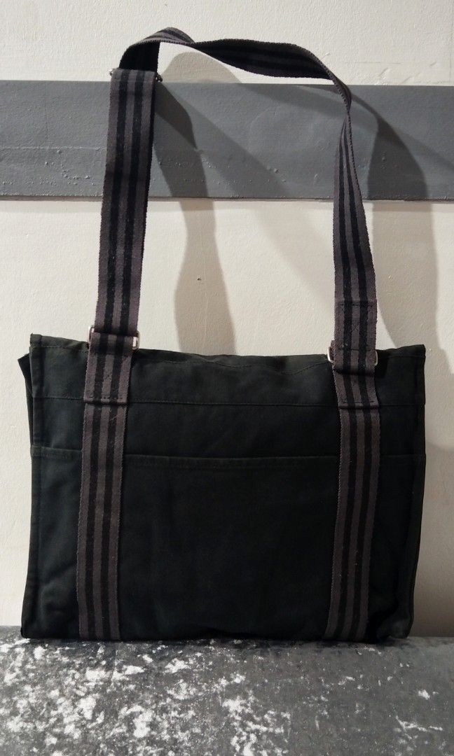 Authentic/Vintage Hermes Messenger Bag Canvas (Category: Cross-body Bags) located in Baguio. Submitted by shopdailybasket (Listing ID 1466098018, Image 2). Description: 100% Authentic Fourre-Tout Bassas (also known as the Herline or Fourre-Tout Messenger) MM (Medium Model) Heavy-duty cotton canvas Black and Grey striped webbing trim Brushed palladium/silver-tone snap button Exterior Design Features Characterized by the iconic signature vertical s