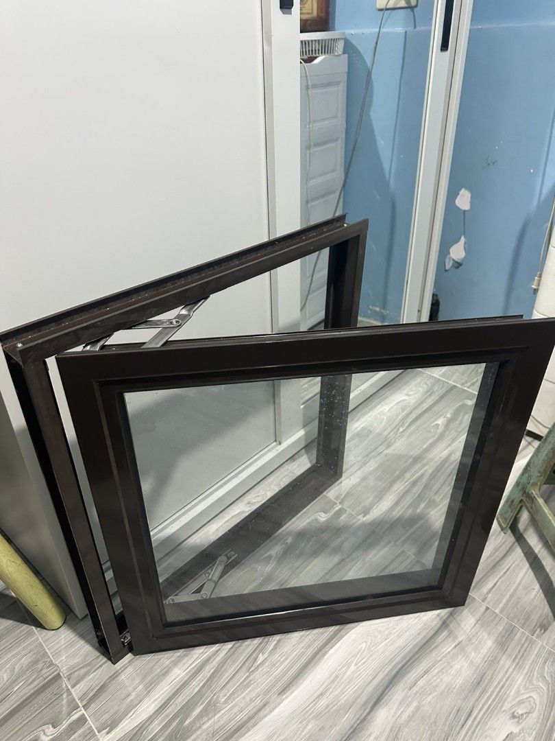 Awning window 60x60cm (Category: Office Furniture & Fixtures) located in Manila. Submitted by suzanneber43600 (Listing ID 1466069460, Image 2). Description: Brown Aluminium Casement Window with Glass and Frame - Type: Casement window - Frame: Durable brown aluminium - Glass: Clean glass panel included - Hardware: Sturdy metal hinges attached - Condition: Solid build, ready for installation - Ideal for: Home renovation or replacement projects -Nev