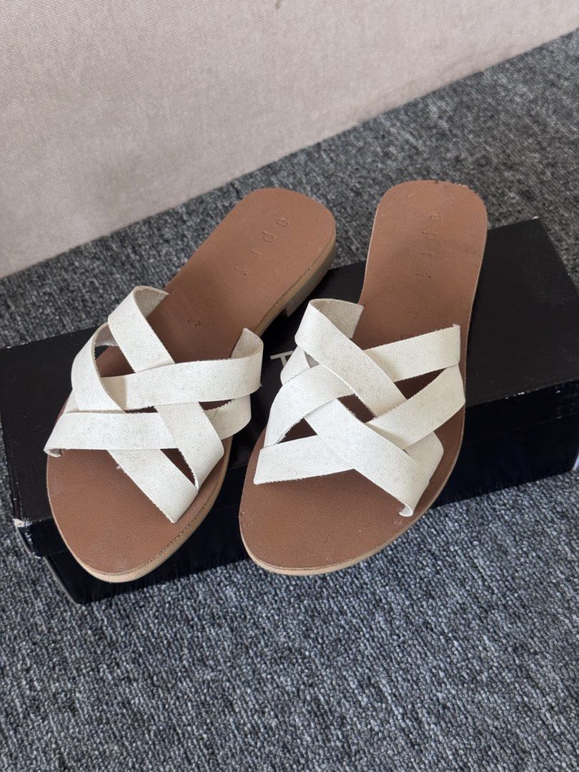 Aztrid Brie Mocha/Bone Sandals Size 5 (Category: Flats & Sandals) located in Manila. Submitted by sm_wardrobe (Listing ID 1466003861, Image 1). Description: Price negotiable. Feel free to message for proofs/inquiries! - Brand: Aztrid Brie - Colorway: Mocha and Bone - Size: 5 - Style: Slip-on, flat sole with stylish interwoven straps - Condition: Brand new, unworn - Inclusion: Original black shoe box.