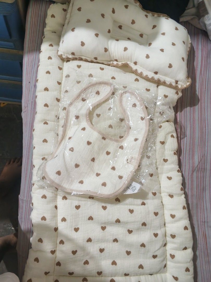Baby Bedding Set with Pillow and Matching Bib (Category: Cots & Cribs) located in Caloocan City. Submitted by dmrosxix (Listing ID 1466112209, Image 2). Description: - Color/Pattern: Cream with brown heart print - Inclusions: Soft cushioned mattress, matching contoured pillow, and brand-new baby bib (still sealed in plastic) - Design: Neutral style, perfect for any nursery theme - Care: Easy to wash fabric - Condition: Excellent, ready for your l