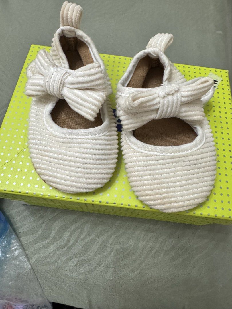 Baby shoes (Category: Babies & Kids Fashion) located in Paranaque City. Submitted by kgsantos (Listing ID 1466073071, Image 1). Description: - Color: White - Size: 11 (fits 3 to 6 months) - Design: Heart cutout on the front with a stylish T-strap - Closure: Easy side Velcro for quick wear and removal Dirty white shoes - needs cleaning White with heart cut out - used thrice Barbie gold shoes - used once Get all three pairs for 300.