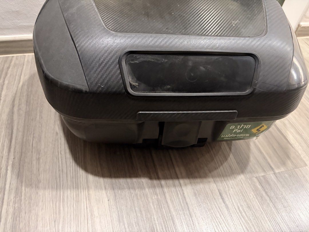 Back box (Category: Motorcycle Accessories) located in Singapore. Submitted by ykm23 (Listing ID 1465979331, Image 2). Description: - Type: Motorcycle back box / storage case - Color: Black with carbon-fiber texture top lid - Features: Large and spacious interior for helmets or gear, includes internal security straps - Note: Sale is for the box only (base plate not included) - Condition: Pre-loved, functional, with normal signs of usage - Pickup 