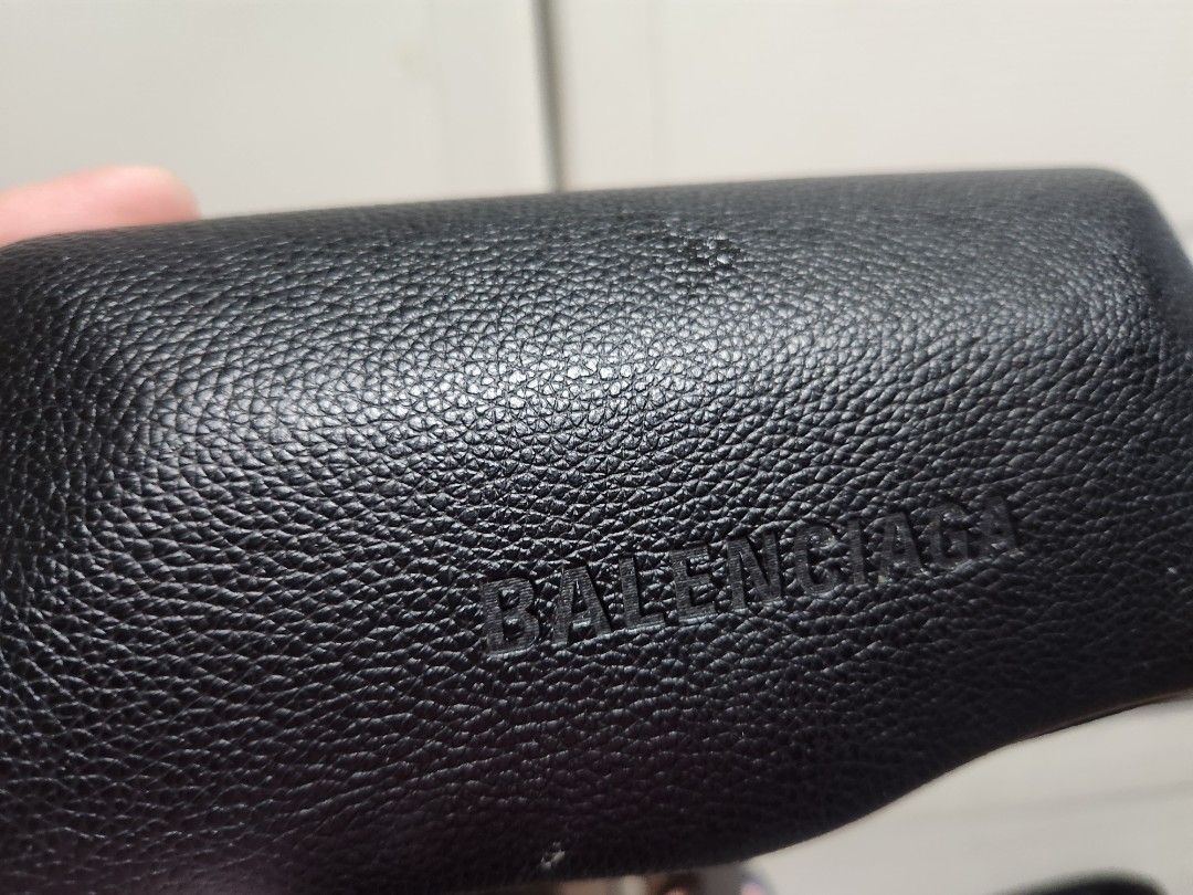 Balenciaga Black Leather Eyeglasses Case (Category: Sunglasses & Eyewear) located in Quezon City. Submitted by amber___18 (Listing ID 1466081998, Image 1). Description: - Authentic Balenciaga eyeglasses case - Premium black grained leather with debossed front logo - Hard structured shell provides maximum protection against damage - Soft black fabric interior featuring repeated Balenciaga monogram print - Sleek, chic, and perfect for luxury daily 