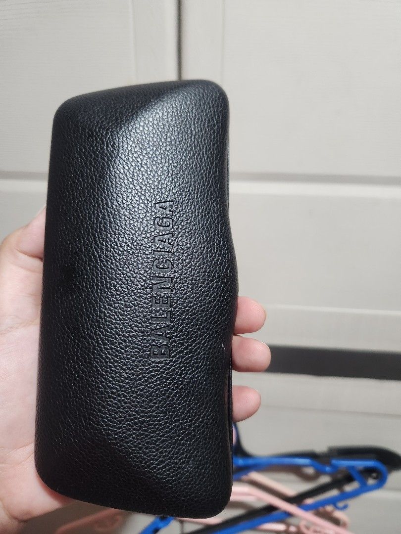 Balenciaga Black Leather Eyeglasses Case (Category: Sunglasses & Eyewear) located in Quezon City. Submitted by amber___18 (Listing ID 1466081998, Image 2). Description: - Authentic Balenciaga eyeglasses case - Premium black grained leather with debossed front logo - Hard structured shell provides maximum protection against damage - Soft black fabric interior featuring repeated Balenciaga monogram print - Sleek, chic, and perfect for luxury daily 