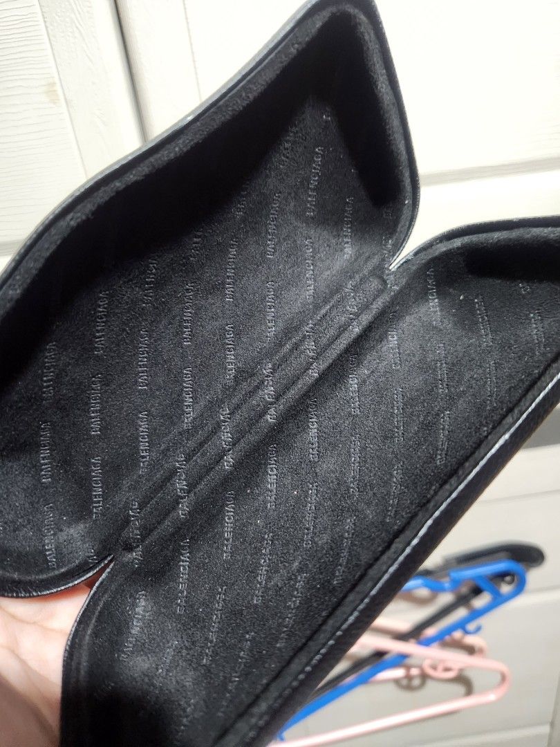 Balenciaga Black Leather Eyeglasses Case (Category: Sunglasses & Eyewear) located in Quezon City. Submitted by amber___18 (Listing ID 1466081998, Image 3). Description: - Authentic Balenciaga eyeglasses case - Premium black grained leather with debossed front logo - Hard structured shell provides maximum protection against damage - Soft black fabric interior featuring repeated Balenciaga monogram print - Sleek, chic, and perfect for luxury daily 