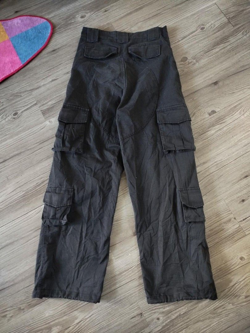 Balenciaga Multi-Pocket Cargo Pants Dark Grey Size S (Category: Jeans) located in Quezon City. Submitted by y2k_thriftkid (Listing ID 1466032273, Image 2). Description: - Brand: Balenciaga - Item: Multi-pocket cargo pants - Color: Dark grey - Size: S (with tag inside) - Origin: Made in Italy - Fit: Relaxed fit - Details: Heavy stitching throughout with multiple utility pockets on both legs - Style: Premium streetwear piece.