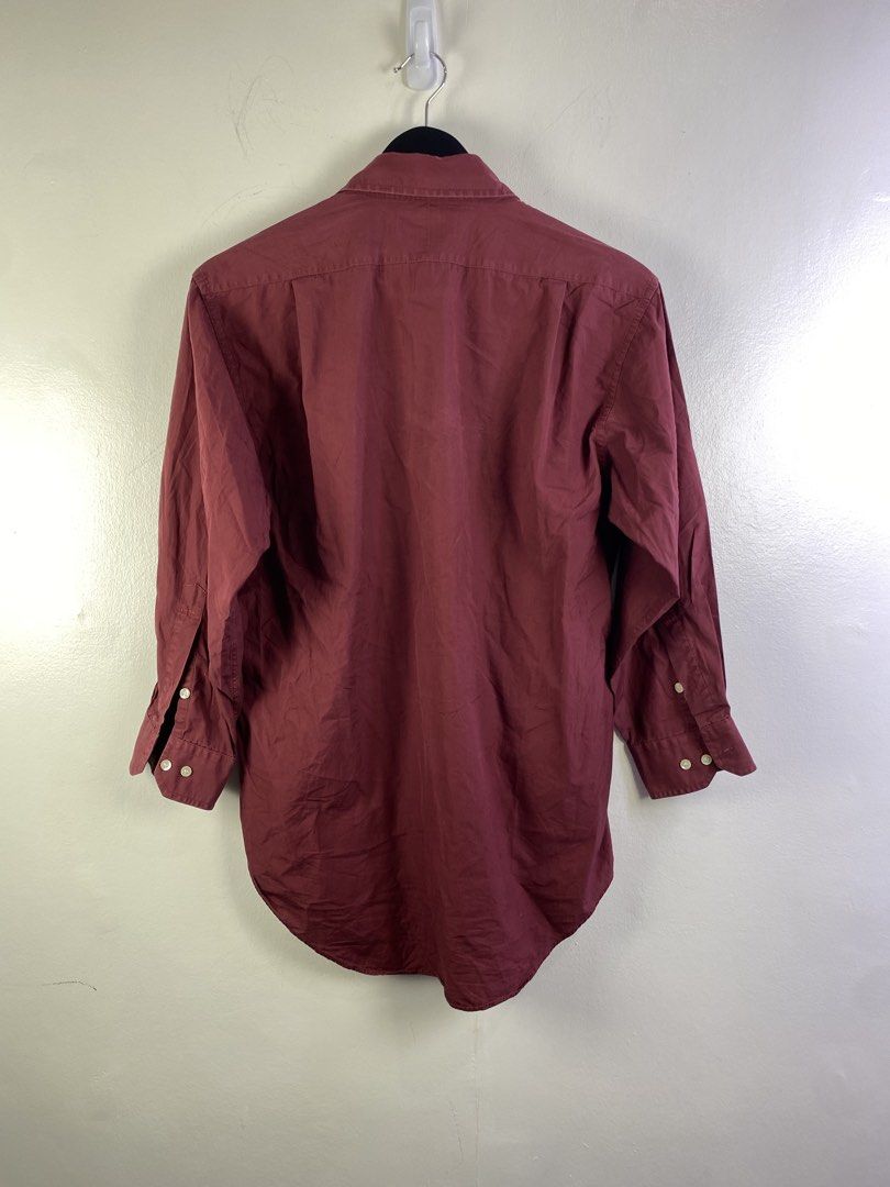 Balenciaga Paris Maroon Button-Up Shirt Medium-84 (Category: Shirts) located in Manila. Submitted by declutterpromax (Listing ID 1466019133, Image 3). Description: - Brand: Balenciaga Paris - Color: Rich maroon / burgundy - Size: Medium-84 - Fit: Traditional tailored fit with curved hem - Details: Long sleeves, pointed collar, front chest pocket, white button closures - Condition: Clean stitching, great for smart-casual wear.