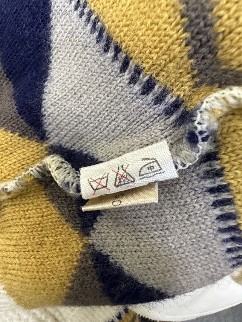 Balenciaga Vintage Turtleneck Cable Knit Pattern Sweater (Category: Longsleeves) located in Manila. Submitted by declutterpromax (Listing ID 1466014876, Image 3). Description: - Color: Cream with navy, mustard yellow, and grey geometric details - Style: Cable knit turtleneck sweater with chunky texture - Design: Geometric patterned hem/cuffs and thick ribbed collar/bottom band - Material: Warm and thick knit, ideal for winter layering - Condition
