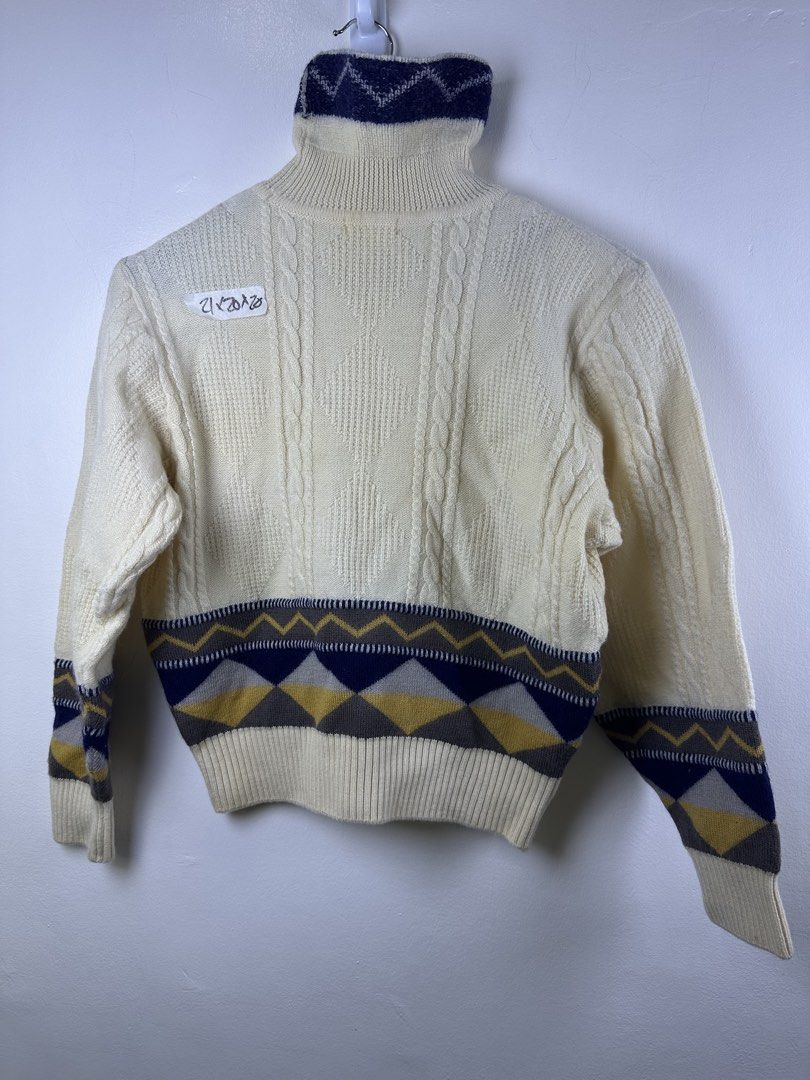 Balenciaga Vintage Turtleneck Cable Knit Pattern Sweater (Category: Longsleeves) located in Manila. Submitted by declutterpromax (Listing ID 1466014876, Image 1). Description: - Color: Cream with navy, mustard yellow, and grey geometric details - Style: Cable knit turtleneck sweater with chunky texture - Design: Geometric patterned hem/cuffs and thick ribbed collar/bottom band - Material: Warm and thick knit, ideal for winter layering - Condition