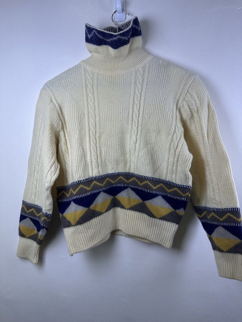 Balenciaga Vintage Turtleneck Cable Knit Pattern Sweater (Category: Longsleeves) located in Manila. Submitted by declutterpromax (Listing ID 1466014876, Image 2). Description: - Color: Cream with navy, mustard yellow, and grey geometric details - Style: Cable knit turtleneck sweater with chunky texture - Design: Geometric patterned hem/cuffs and thick ribbed collar/bottom band - Material: Warm and thick knit, ideal for winter layering - Condition