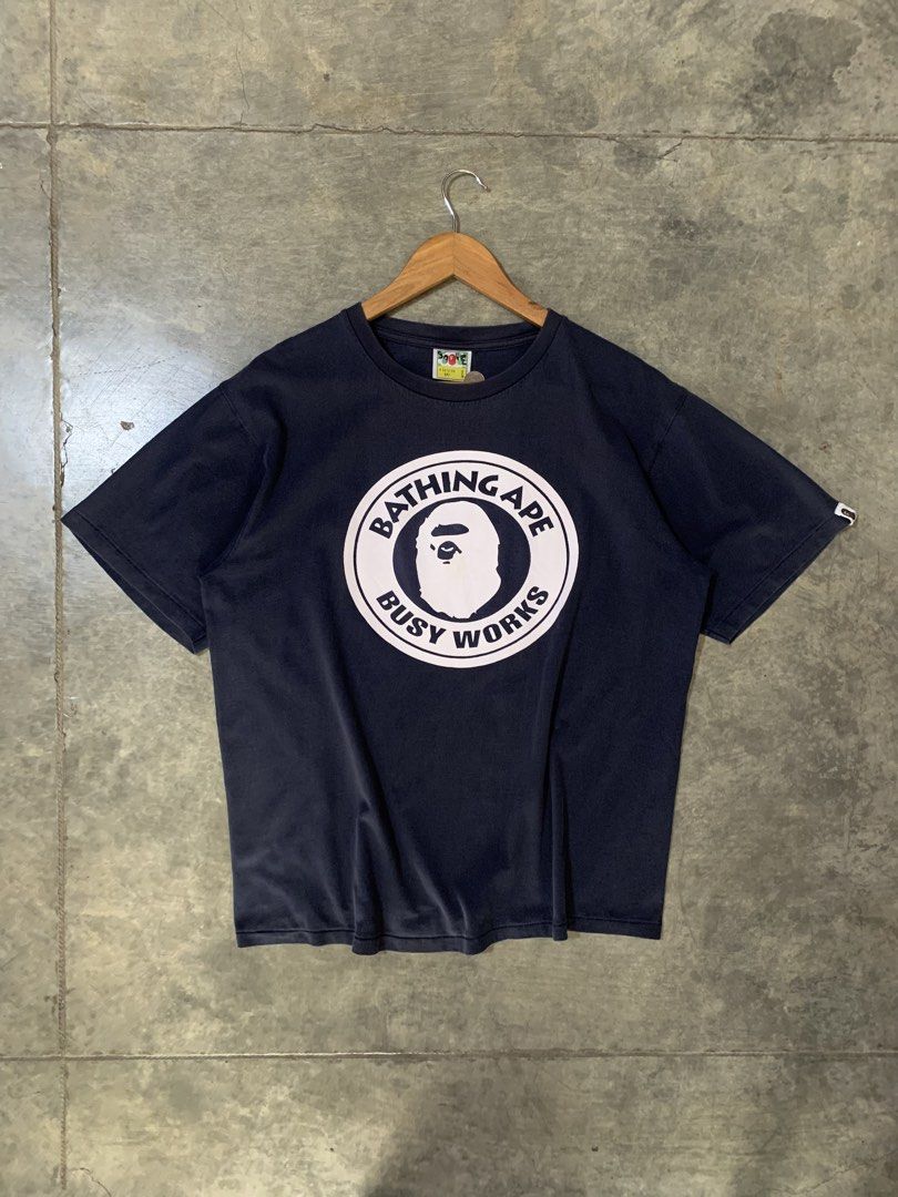 Bape Busy Works (Category: Tshirts & Polo Shirts ) located in Tibiao. Submitted by notaveragethrift (Listing ID 1465986081, Image 1). Description: Width- 22 Length- 28 CR- 9.6/10 or better Excellent Condition Need wash No issue.