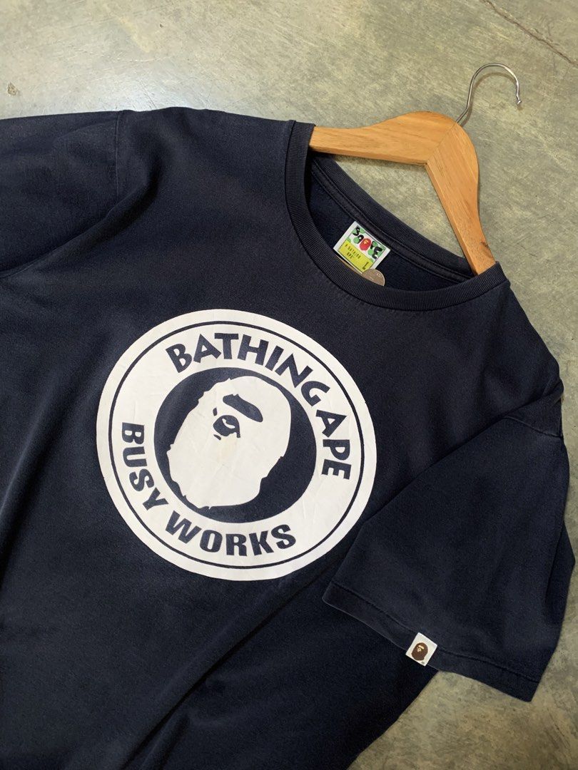 Bape Busy Works (Category: Tshirts & Polo Shirts ) located in Tibiao. Submitted by notaveragethrift (Listing ID 1465986081, Image 2). Description: Width- 22 Length- 28 CR- 9.6/10 or better Excellent Condition Need wash No issue.