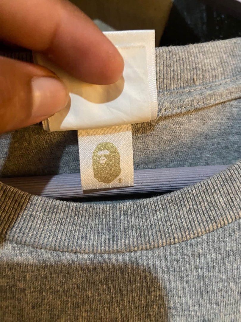 BAPE Shark Full Zip Grey Tee (Category: Tshirts & Polo Shirts ) located in Midsayap. Submitted by monesreenc98619 (Listing ID 1465971359, Image 2). Description: - Brand: BAPE (A Bathing Ape) - Item: Grey Short Sleeve Full-Zip Shark Tee - Design: Iconic multi-color camo shark face graphic on front with full zipper print - Details: Classic Ape head tag on sleeve cuff and interior collar label - Material: Premium heavy cotton feel - Condition: Clean