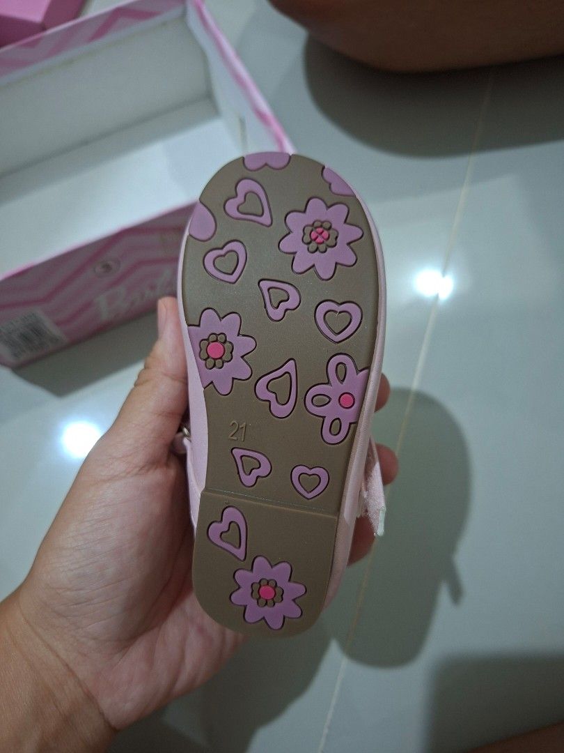 Barbie Pink Glitter (Category: Babies & Kids Fashion) located in Quezon City. Submitted by ronezsaldi02732 (Listing ID 1466059672, Image 2). Description: - Barbie pink glitter toddler mary janes (Size 21) - Adorable flower appliqué on the toe strap - Comfortable low block heel and flower/heart patterned rubber sole - Easy velcro strap closure for quick wear - Includes original Barbie pink shoebox with SM Store price tag.