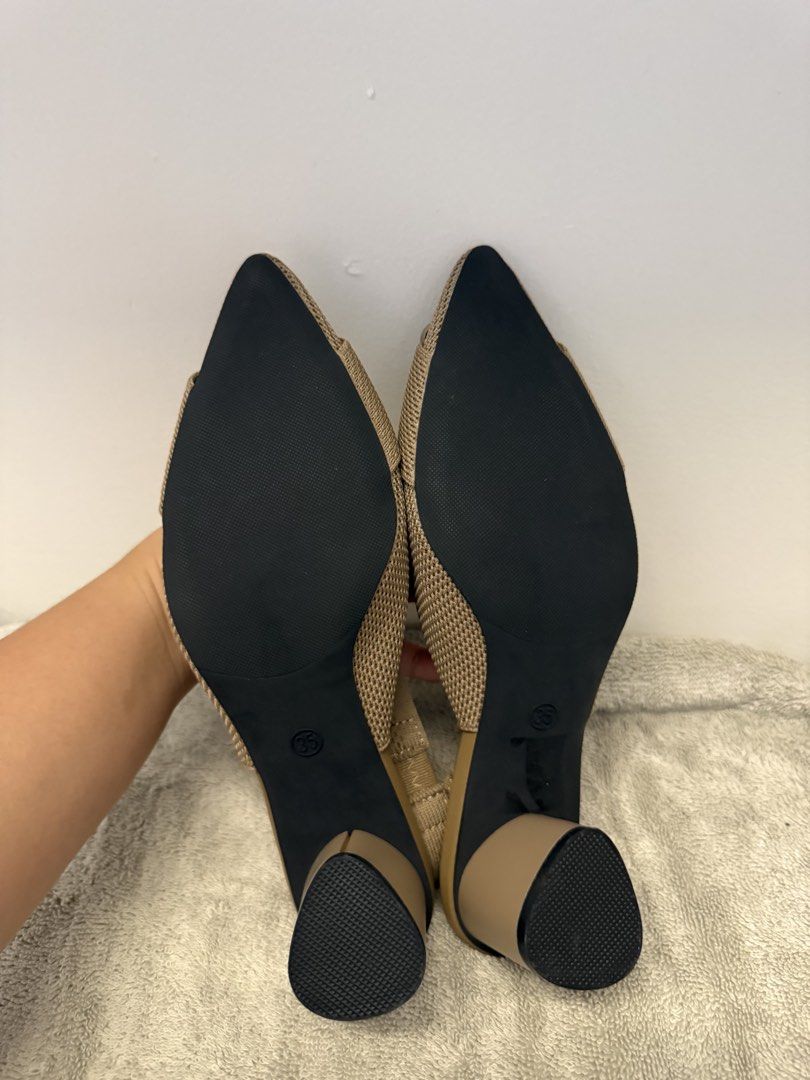 Beige Knitted Slingback Heels with Square Buckle Size 35 (Category: Heels) located in Santa Rosa. Submitted by alyssa21 (Listing ID 1465954746, Image 3). Description: - Size: 35 - Color: Neutral beige - Design: Pointed toe with large front square buckle - Heel: Comfortable chunky block heel - Fit: Elastic slingback strap with adjustment loop - Condition: Soles show zero wear, extremely clean - Versatility: Easy to pair with multiple outfits.
