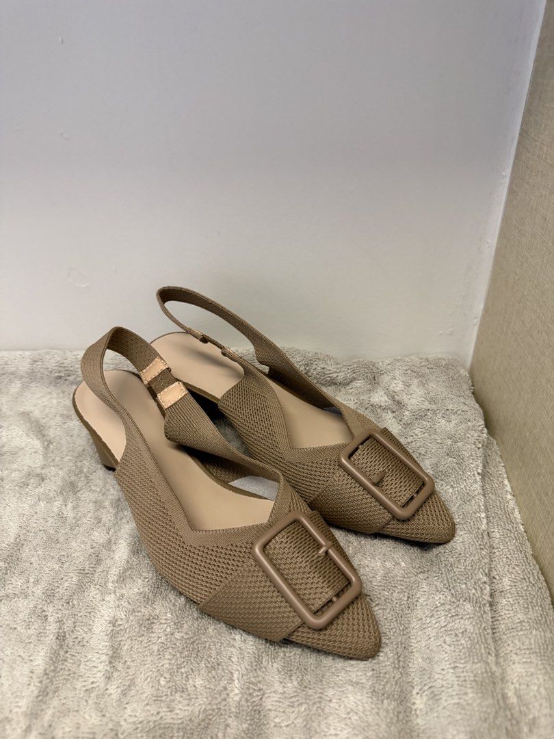 Beige Knitted Slingback Heels with Square Buckle Size 35 (Category: Heels) located in Santa Rosa. Submitted by alyssa21 (Listing ID 1465954746, Image 2). Description: - Size: 35 - Color: Neutral beige - Design: Pointed toe with large front square buckle - Heel: Comfortable chunky block heel - Fit: Elastic slingback strap with adjustment loop - Condition: Soles show zero wear, extremely clean - Versatility: Easy to pair with multiple outfits.