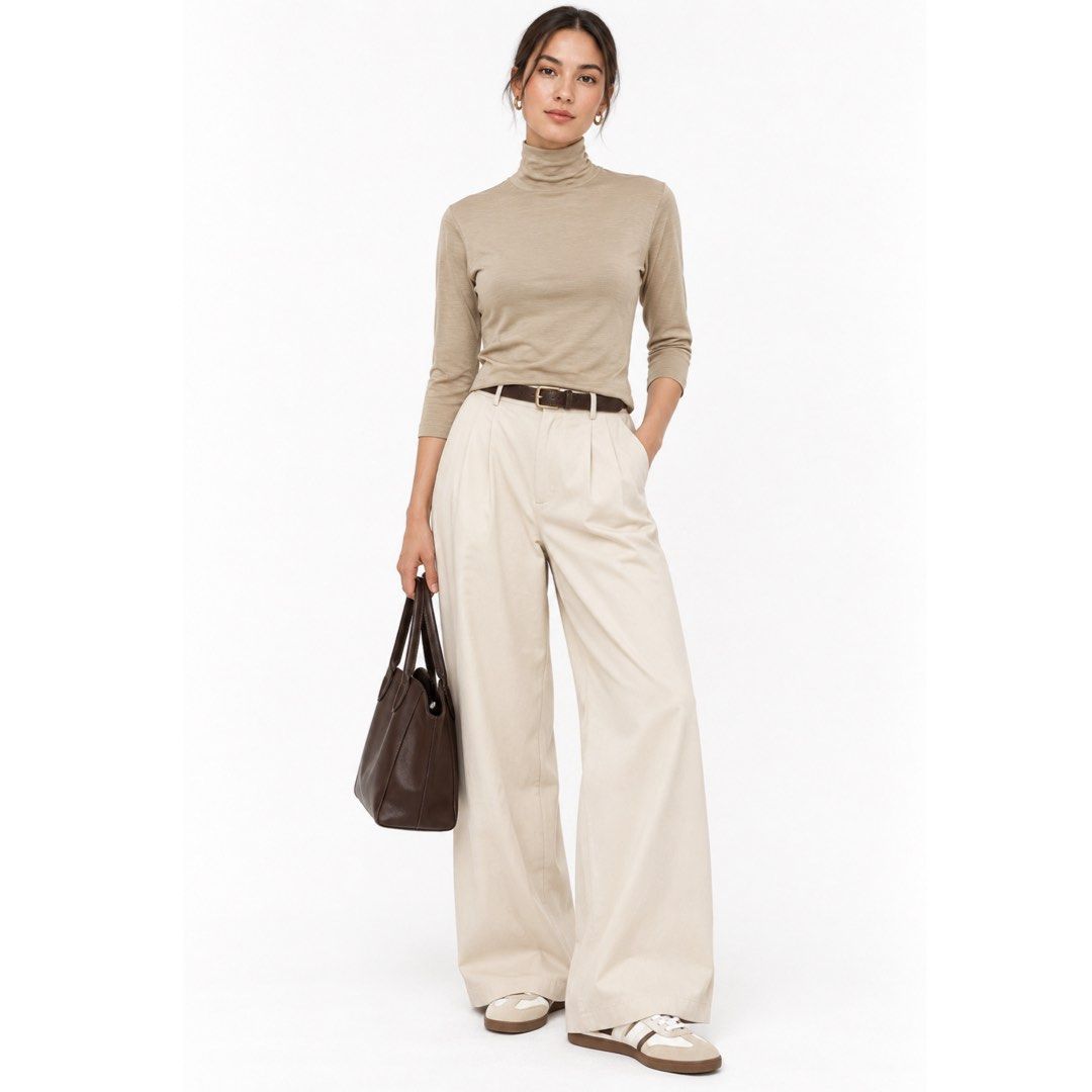 Beige Lightweight Turtleneck 3/4 Sleeve Top | Minimalist Basic | S-M (Category: Longsleeves) located in San Jose del Monte. Submitted by vanessabarredo (Listing ID 1466150132, Image 2). Description: Excellent condition. Minimalist beige/taupe turtleneck top in a lightweight, soft-looking fabric. Features a high neck and 3/4 sleeves — a versatile neutral basic that works well on its own or for layering. Measurements: Width: 17.5” Length: 23” Best 