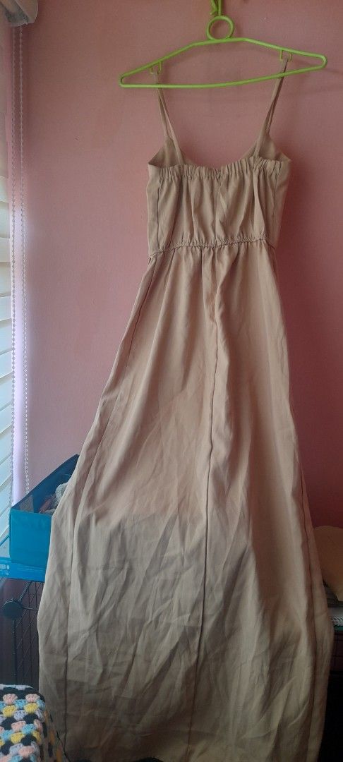 Beige Spaghetti Strap Midi Dress with Wrap Front (Category: Dresses) located in Manila. Submitted by sec0ndbloom (Listing ID 1466001378, Image 2). Description: - Color: Neutral beige (goes with everything!) - Style: Midi dress with a trendy wrap front - Straps: Delicate thin spaghetti straps - Fit: Comfortable elastic waistband at the back for easy wear - Skirt: Beautiful, breezy flowy skirt section.