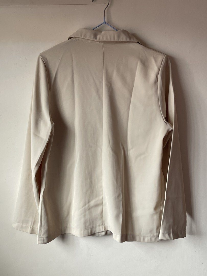 Beige tailored blazer jacket with front pockets and button (Category: Coats, Jackets and Outerwear) located in Calamba. Submitted by everyday.closet (Listing ID 1466015904, Image 3). Description: fits small to medium - Color: Neutral beige - Design: Classic lapel collar, single-button front closure, and structured shoulders - Pockets: Two functional front pockets with flaps - Sleeves: Long sleeves - Fabric: Lightweight and breathable, perfect for