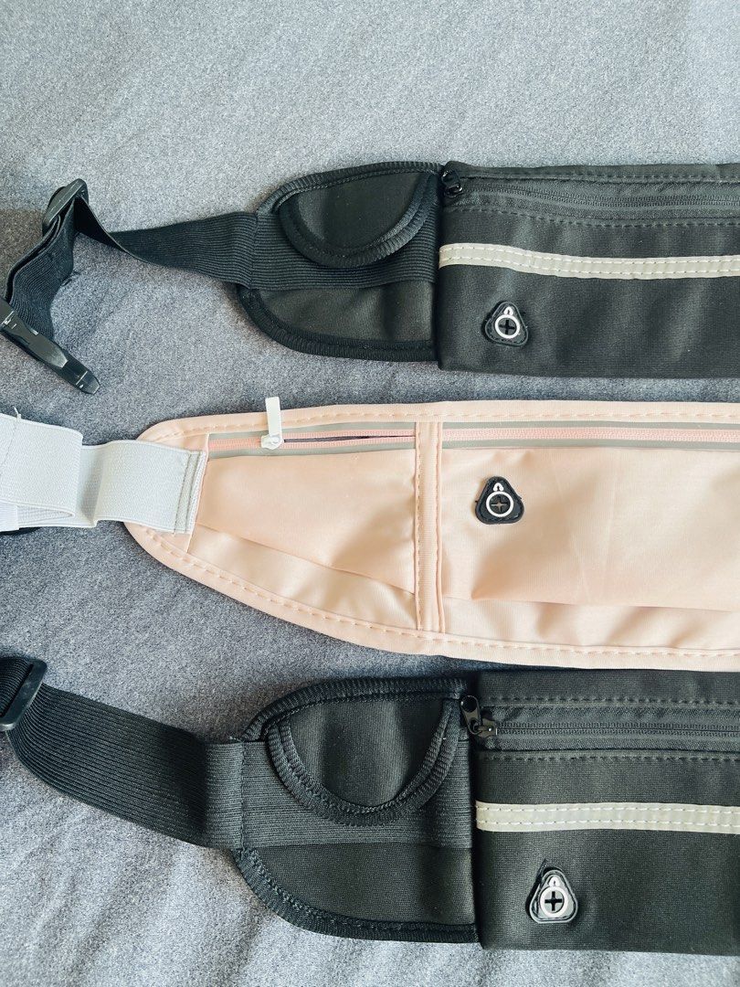 Belt Bag (Category: Belt bags, Clutches and Pouches) located in Manila. Submitted by ttbbkk (Listing ID 1465974584, Image 3). Description: - Colors available: 2x Black, 1x Light Pink - Secure zippered pockets for your phone and keys - Adjustable elastic strap with buckle fits most waists comfortably - Reflective front strip for safe night runs - Built-in headphone cable port - Lightweight, no-bounce material stays close to the body while jogging.