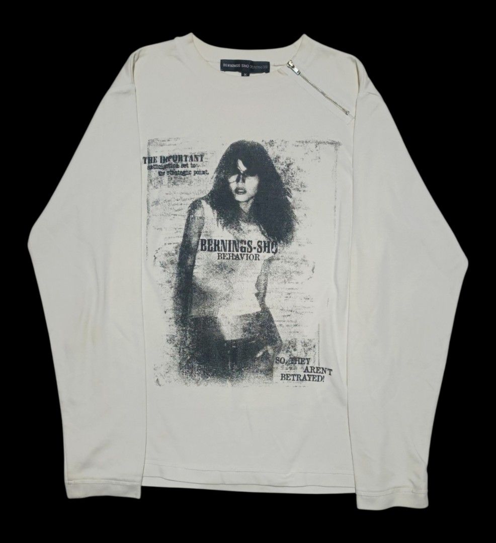 Bernings-Sho Graphic Longsleeve (Category: Longsleeves) located in Calabanga. Submitted by bekneegear (Listing ID 1466123482, Image 1). Description: - Brand: Bernings-Sho - Color: Off-white - Size: Medium (Tag attached) - Design: Large graphic print with 'BERNINGS-SHO BEHAVIOR' text - Details: Diagonal zipper near the collar, brand labels on neck and sleeve hem - Style: Unique grunge streetwear.