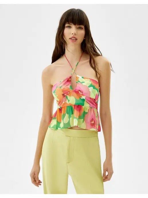 Bershka Floral Halter Top (Category: Sleeveless) located in Batangas. Submitted by wearmegals (Listing ID 1466088728, Image 3). Description: - Brand: Bershka - Design: Vibrant pink, orange, and green floral print with a flowy peplum hem - Details: Adjustable tie straps at the neck and a stylish keyhole cutout at the bust - Condition: Worn once - Large on tag but can fit small to medium .