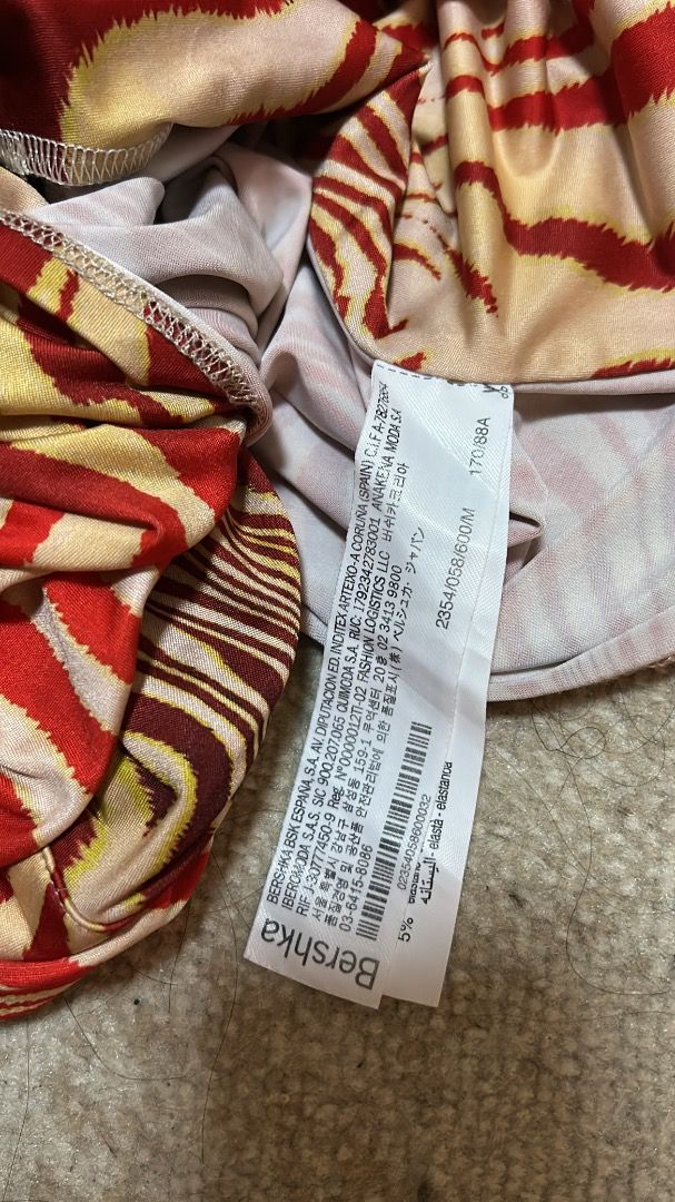 Bershka longsleeve top (Category: Longsleeves) located in Manila. Submitted by cvntlab (Listing ID 1466119763, Image 3). Description: - Red and yellow abstract wavy animal print - Long sleeve mesh style top with stretch - Collared neck with front lace-up tie closure - Trendy cropped length .
