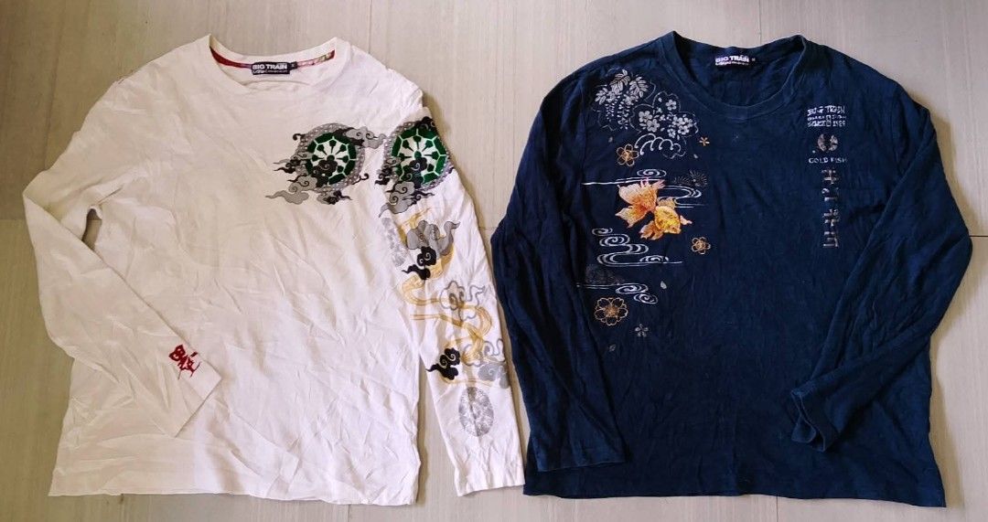 Big Train Long Sleeve T-Shirts Bundle (Category: Tshirts & Polo Shirts ) located in Manila. Submitted by keencrystal.595c28 (Listing ID 1466056848, Image 1). Description: - Brand: Big Train - Quantity: Bundle of 2 long sleeve crewneck shirts (White and Navy Blue) - Material & Fit: Soft cotton fabric, regular fit - White Shirt Details: Detailed Japanese-style deity graphic on the back, patterned sleeves, and red Chinese character embroidery - Navy