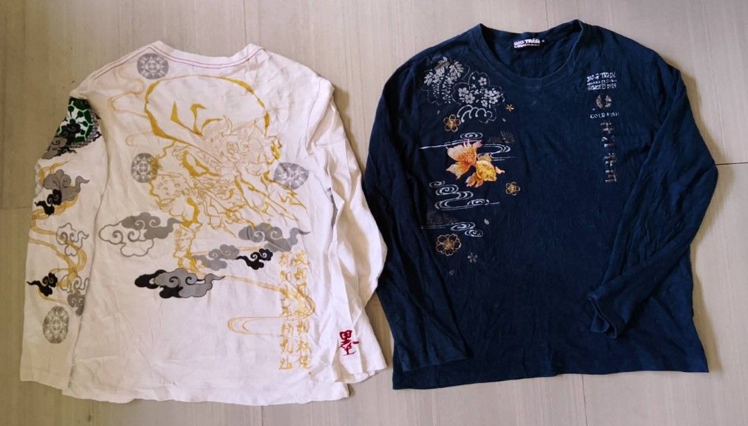 Big Train Long Sleeve T-Shirts Bundle (Category: Tshirts & Polo Shirts ) located in Manila. Submitted by keencrystal.595c28 (Listing ID 1466056848, Image 2). Description: - Brand: Big Train - Quantity: Bundle of 2 long sleeve crewneck shirts (White and Navy Blue) - Material & Fit: Soft cotton fabric, regular fit - White Shirt Details: Detailed Japanese-style deity graphic on the back, patterned sleeves, and red Chinese character embroidery - Navy
