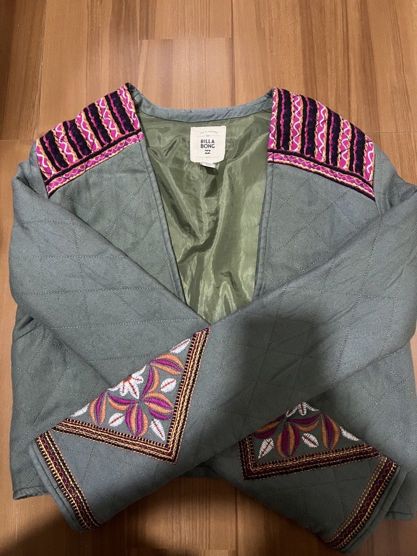 Billabong Quilted Embroidered Boho Jacket Size S (Category: Coats, Jackets and Outerwear) located in Manila. Submitted by icaricsz_szs (Listing ID 1466058977, Image 1). Description: - Brand: Billabong - Size: Small (Made in India) - Color: Muted sage green with olive lining - Design: Open front quilted jacket with vibrant pink, purple, and yellow floral embroidery on the back, shoulders, and cuffs - Material: 100% Rayon shell, 100% Polyester lini