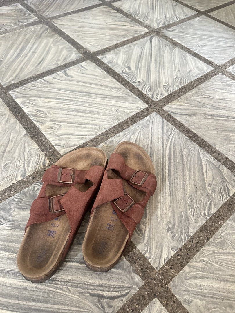 Birkenstock Brown Sandals (Category: Slippers & Slides) located in Manila. Submitted by gelomannn (Listing ID 1465990929, Image 1). Description: Birkenstock Arizona Brown Suede Sandals Size 42. Soft Bed. Slightly used. Not thrifted. Classic two-strap style. Suede upper material. Soles show moderate wear from regular use. Tread patterns still intact. Comfortable footbeds ready for everyday casual wear. Php 2500 Ship thru JnT. Lalamove. Los Baños, 