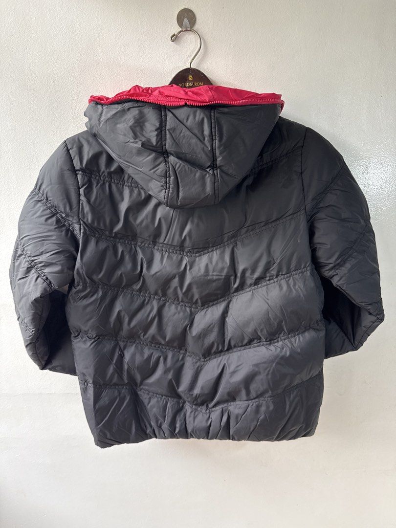 Black and Pink Puffer Jacket with Hood (Category: Coats, Jackets and Outerwear) located in Quezon City. Submitted by dropdeadprices (Listing ID 1466015462, Image 3). Description: - Color: Black with vibrant pink lining and zipper - Size: fits small to medium - Design: Quilted chevron pattern - Features: Attached hood and two zippered side pockets - Condition: Clean, thick material, excellent for cold weather and ready to wear.
