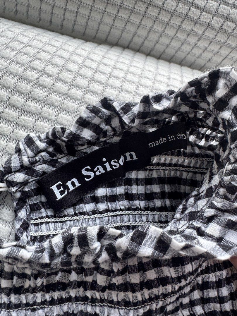 Black and white gingham checkered babydoll blouse (Category: Blouses) located in Manila. Submitted by sofiashionable (Listing ID 1466037546, Image 2). Description: has a high ruffled mock neckline and short puff sleeves.