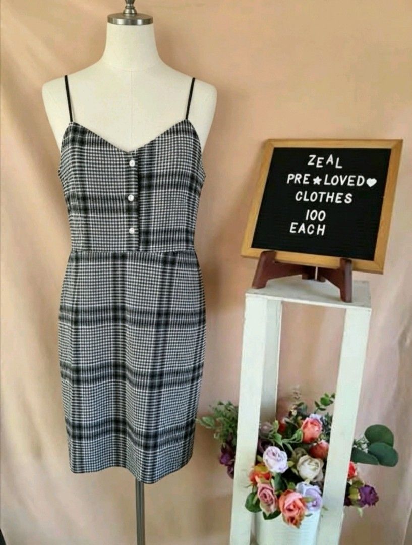 Shein Black and white plaid spaghetti strap dress (Category: Dresses) located in Manila. Submitted by charlottej01596 (Listing ID 1465973773, Image 1). Description: - Pattern: Timeless black and white plaid - Style: Spaghetti straps, v-neckline, and 3 decorative front buttons - Fit: Fitted bodice with a knee-length straight pencil skirt - Fabric: Lightweight and comfortable - Condition: like new / Excellent (ready to wear) - Mode of Payment: GCas