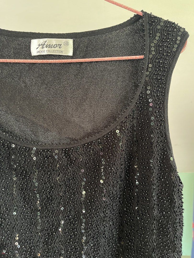 Black Beaded Sequin Top (Category: Sleeveless) located in Baybay. Submitted by shikita27906 (Listing ID 1466034805, Image 2). Description: - Brand/Model: Amor Jackie Collection - Size: S-M - Color: Black - Style: Sleeveless scoop neck tank top - Front Design: Covered in sparkly black beads and sequins with beaded neckline trim.