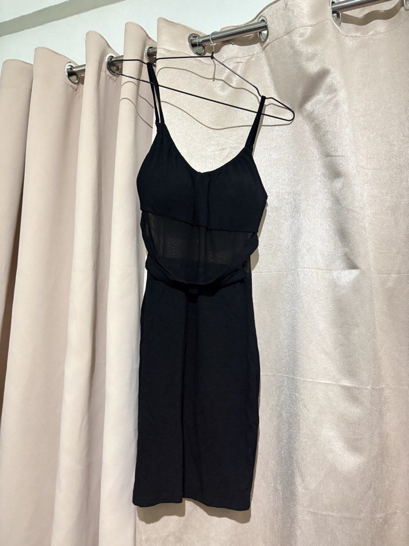 Black bodycon spaghetti strap dress with mesh midsection (Category: Dresses) located in Taguig. Submitted by marbsanne (Listing ID 1466065674, Image 1). Description: - Color: Black - Style: Bodycon, knee-length fitted silhouette - Neckline & Straps: Sweetheart neckline with spaghetti straps - Detail: Sheer mesh panel across the midsection - Fabric: Comfortable with stretch for a great fit - Condition: Brand new / Excellent (ready to wear).