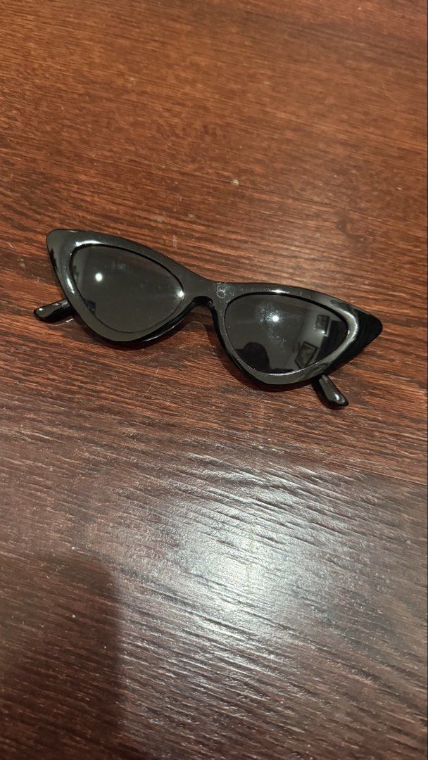 Black Cat Eye Sunglasses (Category: Sunglasses & Eyewear) located in Quezon City. Submitted by ryanbuysandsells (Listing ID 1465993420, Image 3). Description: - 650 for all, 100 per shades - Sleek black cat eye frames with sharp, angular design - Dark tinted lenses for ultimate sun protection - Lightweight plastic build that is easy to carry - Minimalist style that pairs well with any outfit - Brand new and ready to ship!.