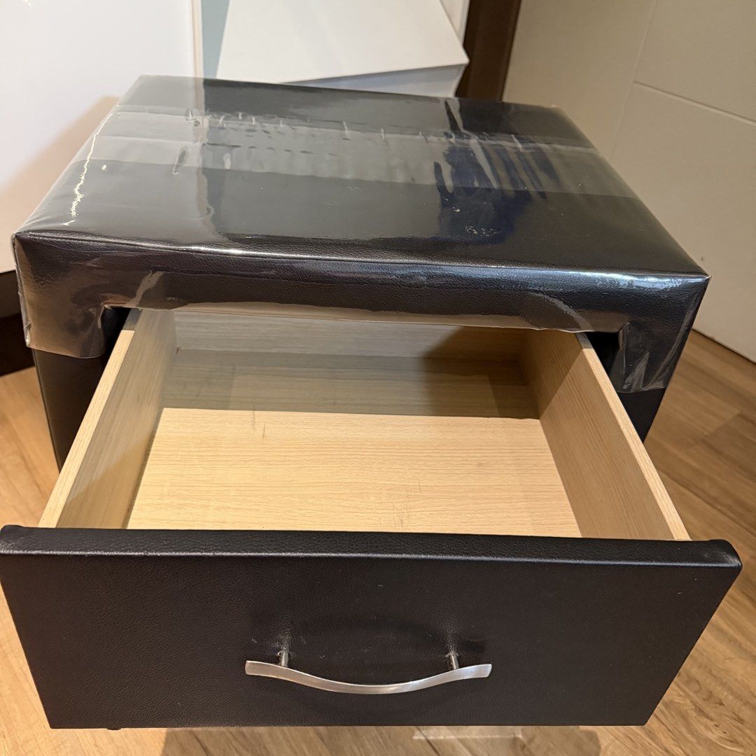 Black Faux Leather 2-Drawer Nightstand Bedside Table (Category: Shelves, Cabinets & Racks) located in Manila. Submitted by gminshie (Listing ID 1466043439, Image 3). Description: For Sale: 2x Bed Side Cabinet — 3k each. 48x40x54 Good as new. No issue. (Plastic cover on top can be removed. For dust purposes only. 😅).