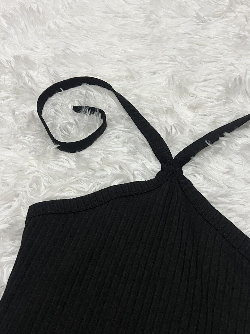 Black Halter Neck Ribbed Tank Top (Category: Sleeveless) located in Tuguegarao City. Submitted by love_clothies (Listing ID 1466106247, Image 2). Description: - Color: Black - Style: Halter neck, ribbed design, slim fit - Material: Soft and stretchy knit fabric - Versatile basic: Great for layering or wearing on its own - Condition: Brand new / Excellent.