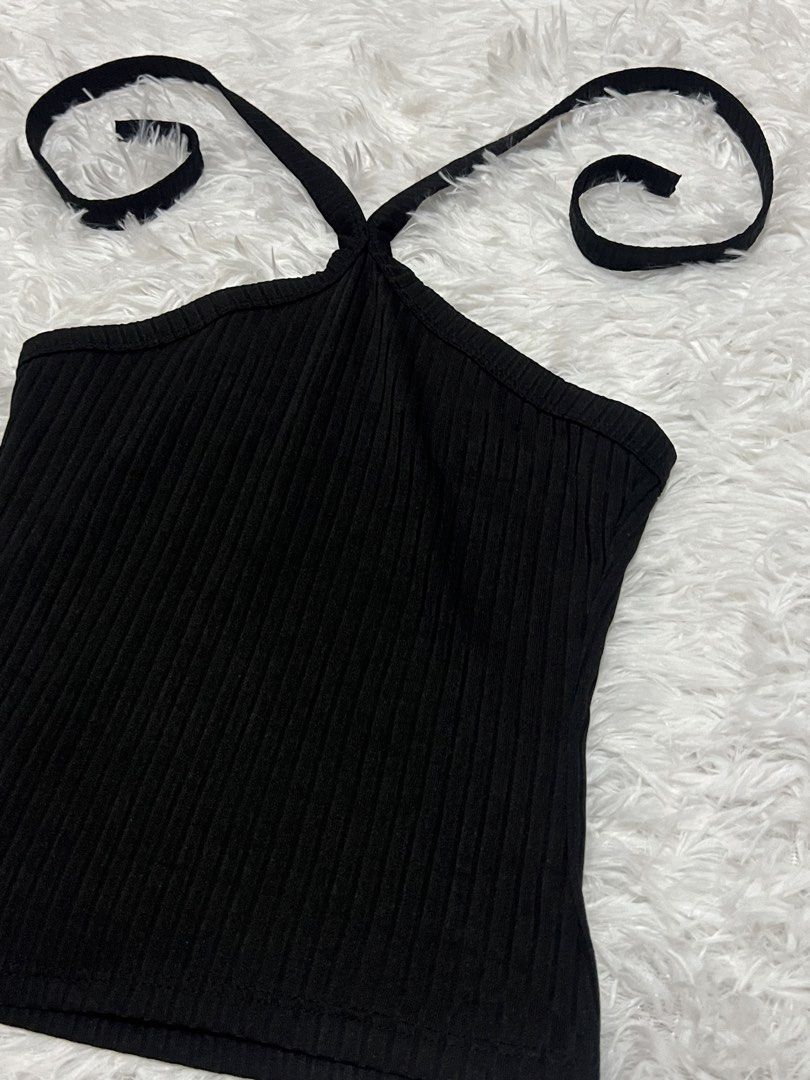 Black Halter Neck Ribbed Tank Top (Category: Sleeveless) located in Tuguegarao City. Submitted by love_clothies (Listing ID 1466106247, Image 3). Description: - Color: Black - Style: Halter neck, ribbed design, slim fit - Material: Soft and stretchy knit fabric - Versatile basic: Great for layering or wearing on its own - Condition: Brand new / Excellent.