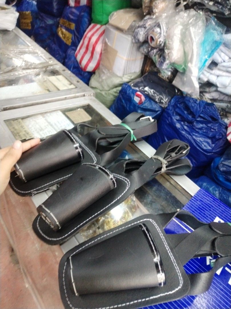 Black Leather Tool Holster Utility Pouch with Strap (Category: Belt bags, Clutches and Pouches) located in Manila. Submitted by jevygalola90020 (Listing ID 1466128522, Image 2). Description: - Color & Material: Black leather with striking white stitching - Design: Pouch-style utility holster with a sturdy build - Fit: Long adjustable strap for comfortable hip wear - Function: Securely holds small tools and everyday essentials - Condition: Clean a
