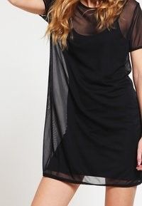 Black mesh overlay short sleeve dress (Category: Dresses) located in Quezon City. Submitted by corrnic (Listing ID 1466042787, Image 1). Description: - Color: Black - Style: Short sleeve dress with relaxed fit and scoop neckline - Design: Sheer mesh top layer with a solid inner slip layer - Fabric: Lightweight and sheer - Condition: Clean and ready to wear.
