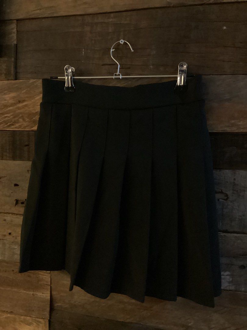Black Pleated Mini Skirt with Elastic Back (Category: Skirts) located in Quezon City. Submitted by makingroomfinds (Listing ID 1466125395, Image 1). Description: - Color: Solid black - Style: Mini skirt with trendy front pleats - Comfort: Elasticated waistband at the back for a flexible fit - Size (Flat Lay): Waist width ~13 inches, Total length ~17 inches.