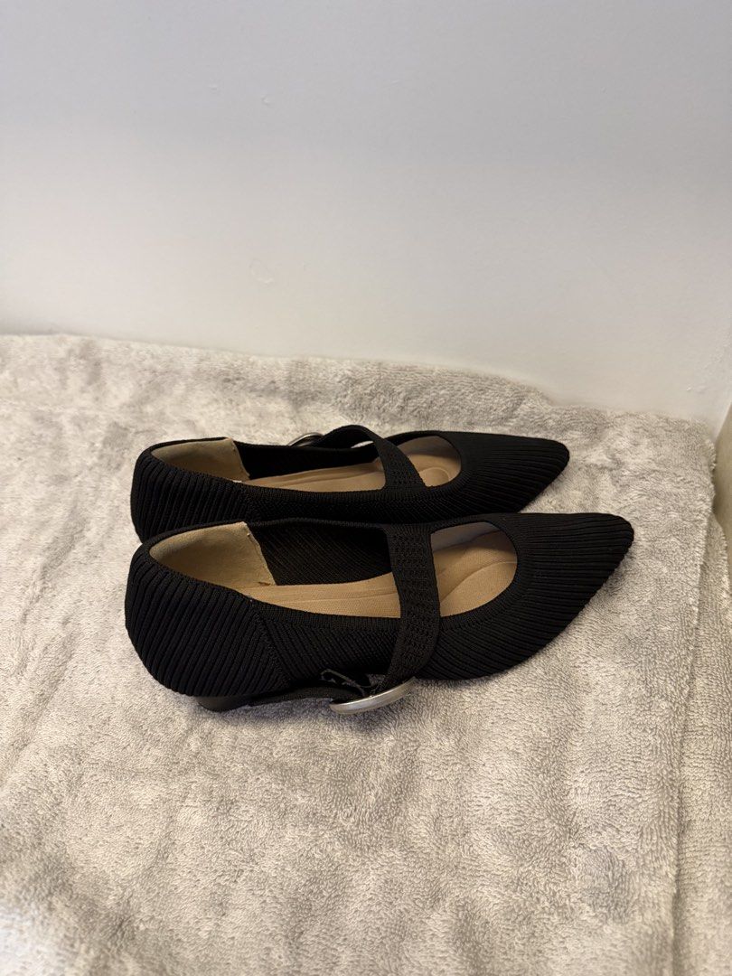Black Pointed Toe Knit Mary Jane Flats Size 35 (Category: Flats & Sandals) located in Santa Rosa. Submitted by alyssa21 (Listing ID 1465954994, Image 2). Description: - Color & Material: Black with a stylish textured knit - Design: Mary Jane style with an adjustable silver buckle strap - Heel: Comfortable low block heel for subtle lift - Size: Marked Size 35 on the bottom - Condition: Soles show minor wear from walking outside, still in great wea