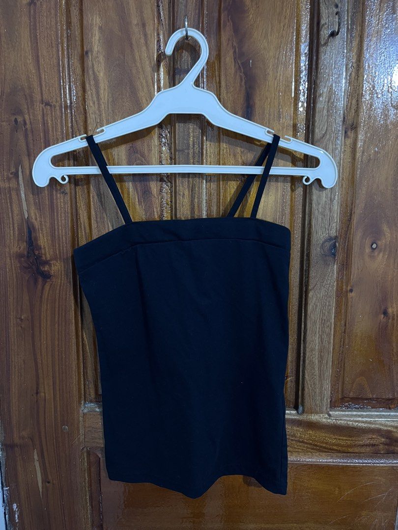 Black Spaghetti Strap Tank Top (Category: Sleeveless) located in Baguio. Submitted by gbwardrobe (Listing ID 1466096790, Image 1). Description: - Color: Classic black - Material: Soft, stretchy cotton for a flattering, body-hugging fit - Design: Spaghetti straps with a straight neckline - Versatility: Essential basic piece that pairs well with jeans, skirts, or shorts - Condition: Worn a few times, freshly washed, clean with no holes or fading.