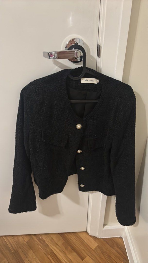 Black Tweed Blazer (Category: Coats, Jackets and Outerwear) located in Paranaque City. Submitted by jujudeclutterss (Listing ID 1466148599, Image 1). Description: - Brand: MX.Studio - Color: Classic Black - Material: Premium textured tweed fabric - Design details: Round neckline, front pockets, and elegant pearl-style buttons - Condition: Excellent, well-maintained - Perfect for: Office wear, corporate meetings, formal events, or smart-casual OOT