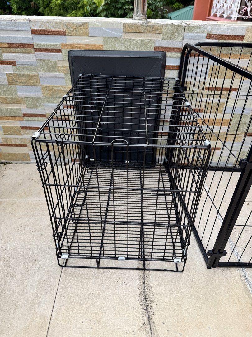 Black wire pet cage with plastic tray (Category: Storage Boxes & Baskets) located in Makati City. Submitted by eeameenelrays (Listing ID 1466136051, Image 2). Description: - Durable heavy-duty black metal wire construction - Includes a dark grey plastic floor tray for easy cleaning - Collapsible design for convenient storage and transport - Secure latches on the front door to keep your pet safe - Ideal size for dogs and puppies - Clean and ready 