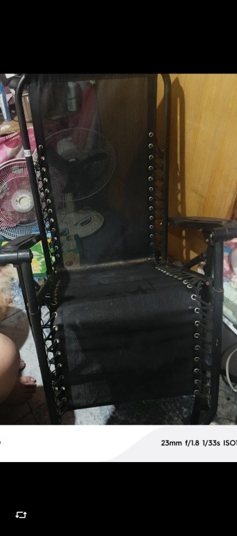 Black Zero Gravity Recliner Lounge Chair (Category: Chairs) located in Quezon City. Submitted by mbitter02 (Listing ID 1466041449, Image 1). Description: - Color: Black - Type: Zero gravity lounge chair with mesh fabric and bungee cords - Frame: Sturdy painted metal - Storage: Folds flat easily - Condition: Clean, no major rips in the mesh - Ideal for: Patio, balcony, or living room relaxation.